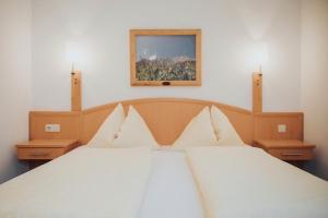 Łóżko lub łóżka w pokoju w obiekcie Appartements Wieshof