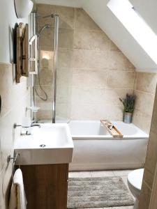 A bathroom at Mill Green Cottage, On site Pools & Spa access