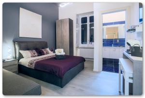 a bedroom with a bed and a sink in it at B&B Palazzo Di Florio in Cava deʼ Tirreni