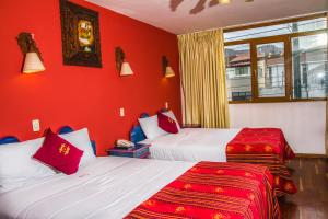Hotel Warari tesisinde bir odada yatak veya yataklar