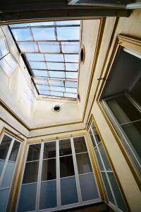 a skylight in the ceiling of a building with windows at Maison Bouquiere La Cabrerie in Bordeaux