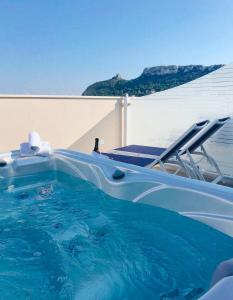 a swimming pool on a boat with a chair at Hotel Nautilus in Cagliari