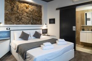 a bedroom with a bed with two towels on it at Villa Azur Cap d'Ail in Cap d'Ail