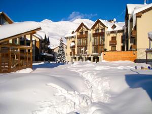 a pile of snow in front of some buildings at GVC New Gudauri Twins 413 Mountain View in Gudauri