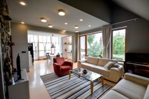 a living room with a couch and a table at Eva's house in Ivanec