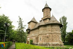 a large building with a tower in the grass at Ambiance studio in Galaţi