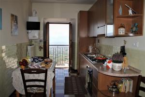 a kitchen with a view of the ocean from a balcony at Bed and Breakfast San Marco Pacentro in Pacentro