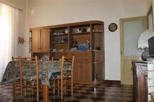a kitchen with a table and chairs and a dining room at Bed and Breakfast San Marco Pacentro in Pacentro