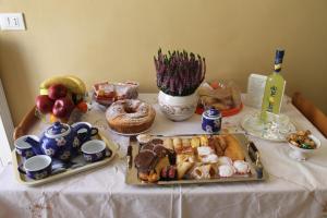 a table with a plate of food on a table at Bed and Breakfast San Marco Pacentro in Pacentro