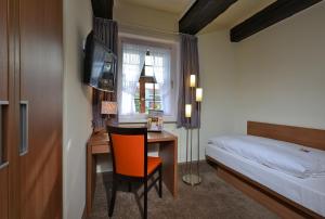 Postel nebo postele na pokoji v ubytování Hotel Ratskeller