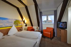 Postel nebo postele na pokoji v ubytování Hotel Ratskeller + 23 fotografií
