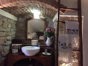 a bathroom with a sink and a mirror at Casa Vacanza Gaia Happy in Costa di Mezzate
