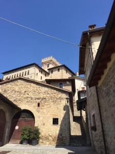 a building with a castle on top of it at Casa Vacanza Gaia Happy in Costa di Mezzate