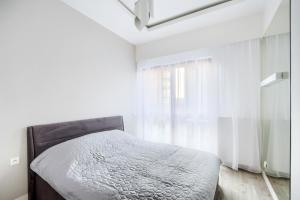 Łóżko lub łóżka w pokoju w obiekcie Exclusive Trendy Apartments