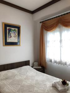A bed or beds in a room at ARCHONTIKO XANTHI