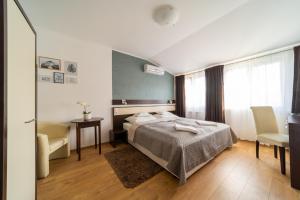 Postel nebo postele na pokoji v ubytování A16 Design Panzió