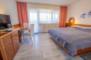 Postel nebo postele na pokoji v ubytování Hotel Klosterhof
