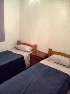 Ένα ή περισσότερα κρεβάτια σε δωμάτιο στο Shangri la