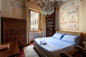 Posteľ alebo postele v izbe v ubytovaní Domus Nannini SPA - Palazzo Nannini