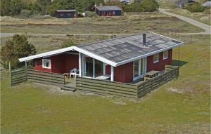 an overhead view of a red house with a porch at 4 Bedroom Gorgeous Home In Fan in Sønderho