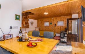 a kitchen and living room with a wooden table at Cozy Home In Prezid With Wifi in Prezid