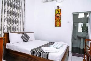 Postel nebo postele na pokoji v ubytování Bon Voyaage Tourist Inn