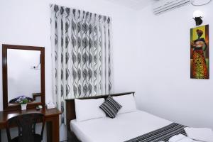 Postel nebo postele na pokoji v ubytování Bon Voyaage Tourist Inn