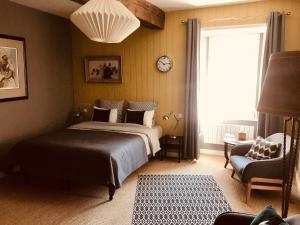 Postel nebo postele na pokoji v ubytování B&B du Cloître