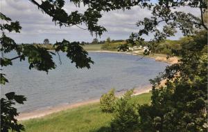 a large body of water with a sandy beach at Cozy Home In Faaborg With Wifi in Fåborg