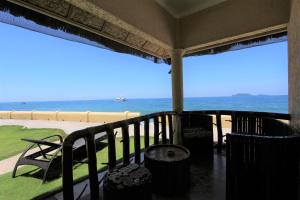 a balcony with a view of the ocean at Thalatta Resort in Zamboanguita