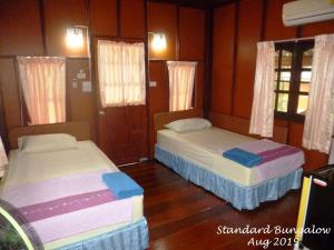 Postel nebo postele na pokoji v ubytování Haad Salad Resort