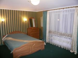 Voodi või voodid majutusasutuse Guest House Svoyaky toas