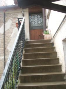 a set of stairs leading up to a house with a door at Il Ghiro in Linaro