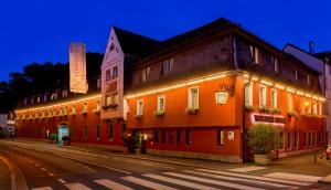 a row of buildings on a street at night at Hotel Wilder Mann in Aschaffenburg