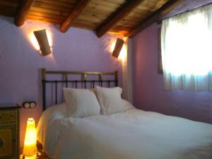 Postel nebo postele na pokoji v ubytování CASA EL CANTÓN