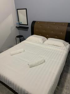Ένα ή περισσότερα κρεβάτια σε δωμάτιο στο Unique 9 HomeStay @ Seremban Taman Permai 3