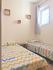 Postel nebo postele na pokoji v ubytování Aux portes du Luberon