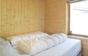 a row of pillows lined up in a room at Gorgeous Home In Dirdal With Wifi in Dirdal +3 photos
