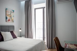 Posteľ alebo postele v izbe v ubytovaní Apartamentos Turísticos Moret11-1B
