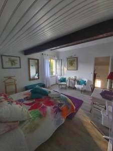 a bedroom with a bed and a living room at Euskadi in Bidart