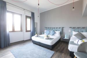 Postel nebo postele na pokoji v ubytování Hotel Miceli - Civico 50