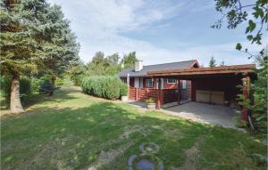 a log cabin with a yard in front of it at Pet Friendly Home In Vig With Wifi in Vig