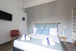 Postel nebo postele na pokoji v ubytování Hotel Miceli - Civico 50