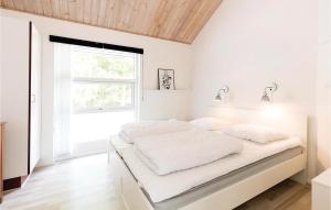 Cama ou camas em um quarto em Rubinsen Skovhuse