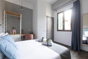 Postel nebo postele na pokoji v ubytování Hotel Miceli - Civico 50