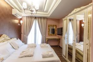 Postel nebo postele na pokoji v ubytování Elite Palace