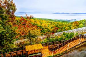 a group of benches sitting on top of a hill at Kyukamura Iwate-Amiharionsen in Shizukuishi