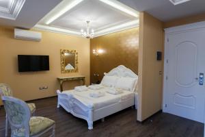 Postel nebo postele na pokoji v ubytování Elite Palace