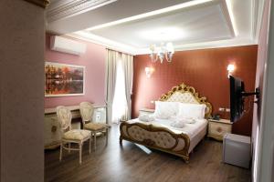 Postel nebo postele na pokoji v ubytování Elite Palace