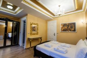 Postel nebo postele na pokoji v ubytování Elite Palace